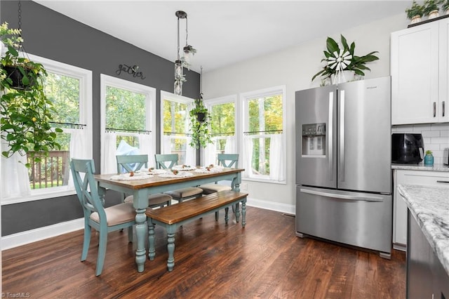 dining room with dark wood-type flooring