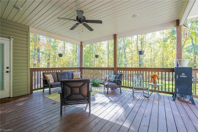 wooden deck featuring an outdoor hangout area and ceiling fan