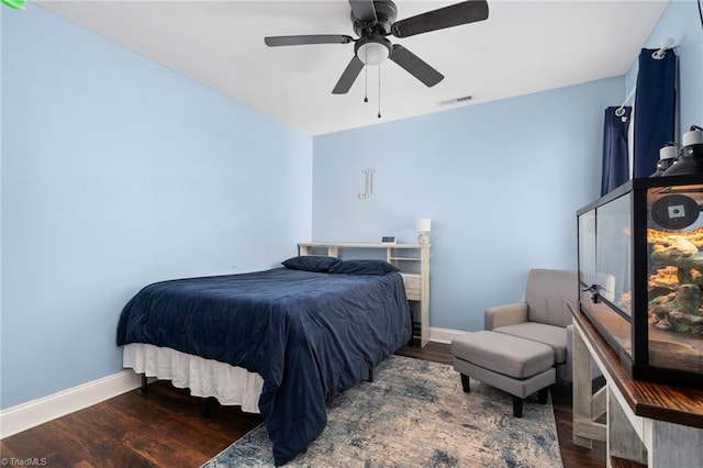 bedroom with hardwood / wood-style floors and ceiling fan