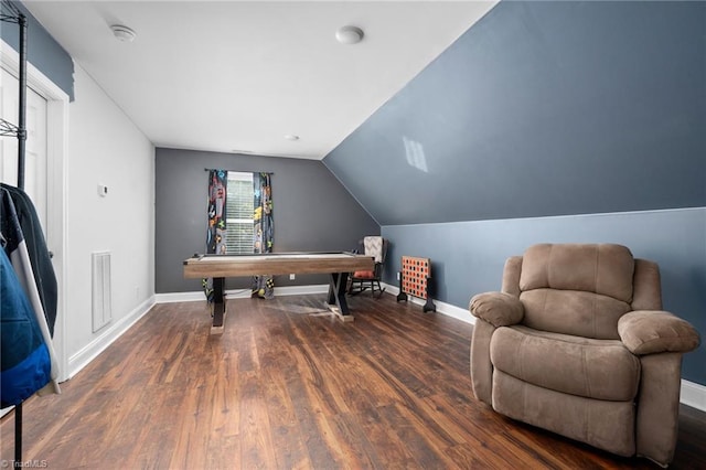 office featuring lofted ceiling and dark hardwood / wood-style flooring