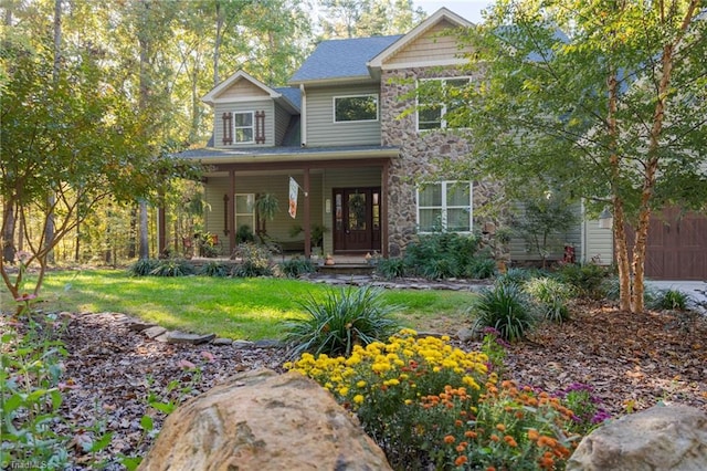 view of front of house featuring a front yard and covered porch