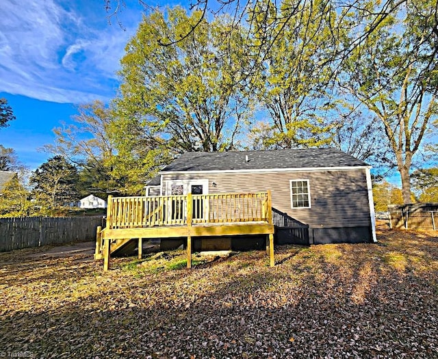 rear view of property with a wooden deck