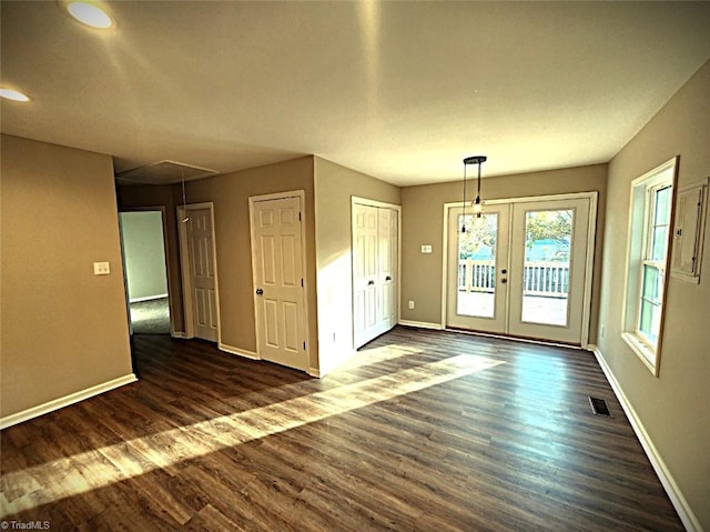 interior space with french doors and dark wood-type flooring