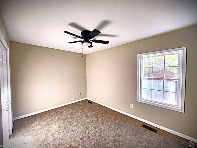 carpeted empty room with ceiling fan