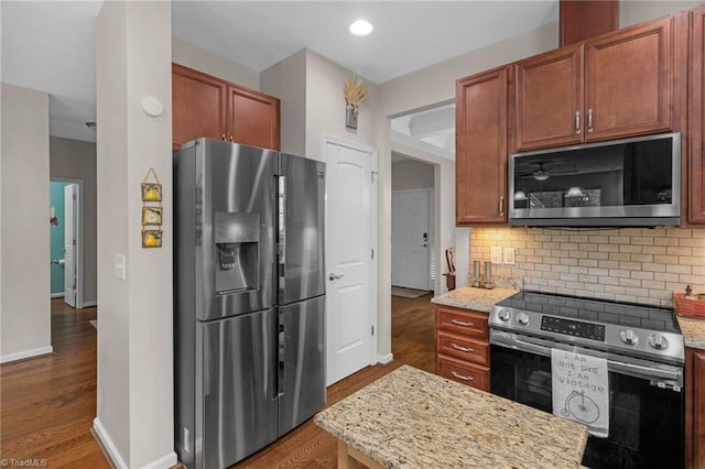 1934 Rubywood St, Greensboro, NC 27405 - kitchen featuring appliances with stainless steel finishes, wood finished floors, and tasteful backsplash
