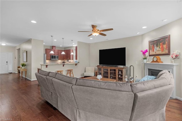 1934 Rubywood St, Greensboro, NC 27405 - living area featuring ceiling fan, a fireplace, baseboards, dark wood-style floors, and recessed lighting