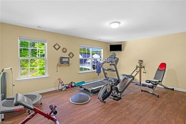 1934 Rubywood St, Greensboro, NC 27405 - exercise room featuring visible vents, baseboards, and wood finished floors