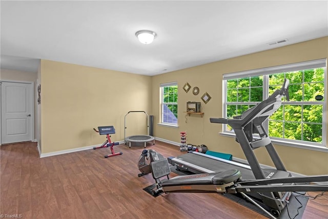 1934 Rubywood St, Greensboro, NC 27405 - workout room with visible vents, baseboards, and wood finished floors