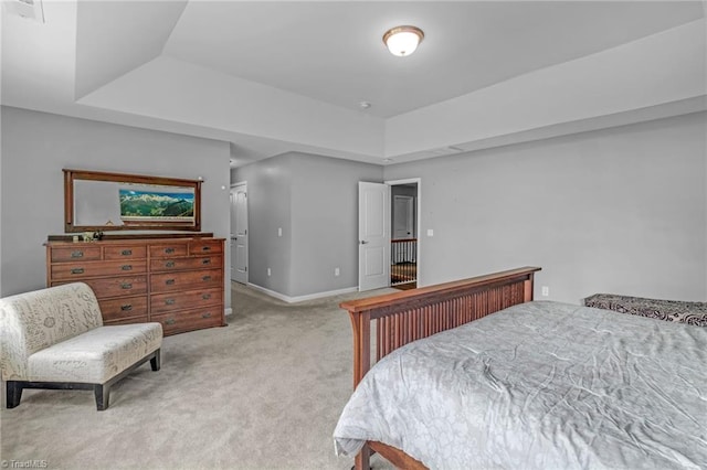 1934 Rubywood St, Greensboro, NC 27405 - bedroom featuring visible vents, baseboards, light colored carpet, and a raised ceiling