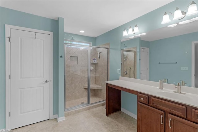 1934 Rubywood St, Greensboro, NC 27405 - full bathroom featuring vanity, baseboards, a stall shower, and tile patterned floors