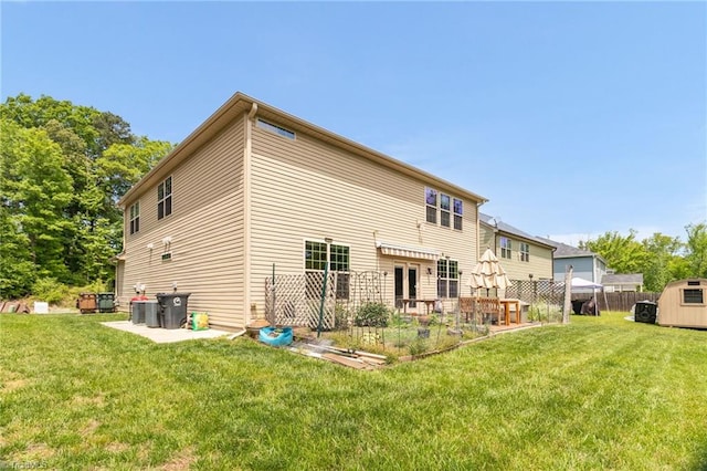 1934 Rubywood St, Greensboro, NC 27405 - rear view of house featuring an outdoor structure, a shed, a yard, and cooling unit
