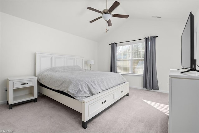 carpeted bedroom with ceiling fan and lofted ceiling