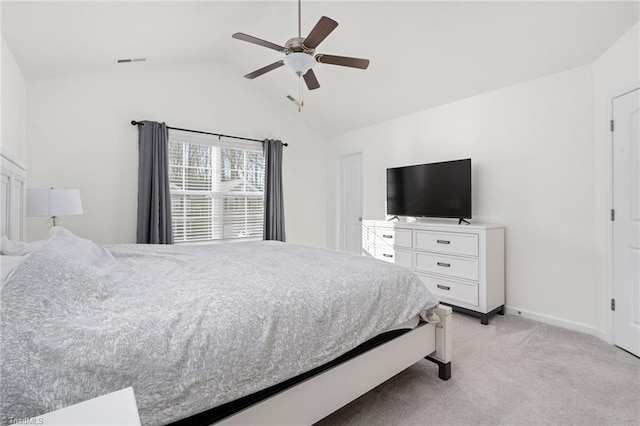 bedroom with ceiling fan, light carpet, and vaulted ceiling