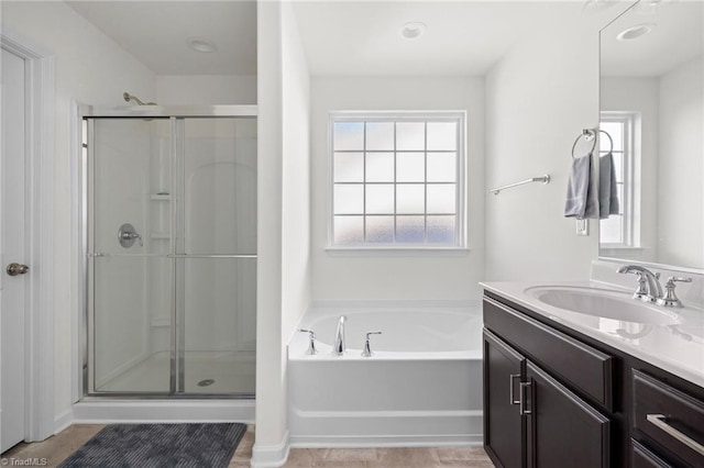 bathroom featuring vanity and separate shower and tub