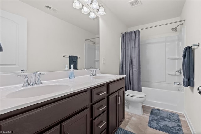 full bathroom featuring shower / bath combo with shower curtain, vanity, and toilet