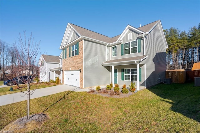 view of front of property with a front lawn, central AC unit, and a garage