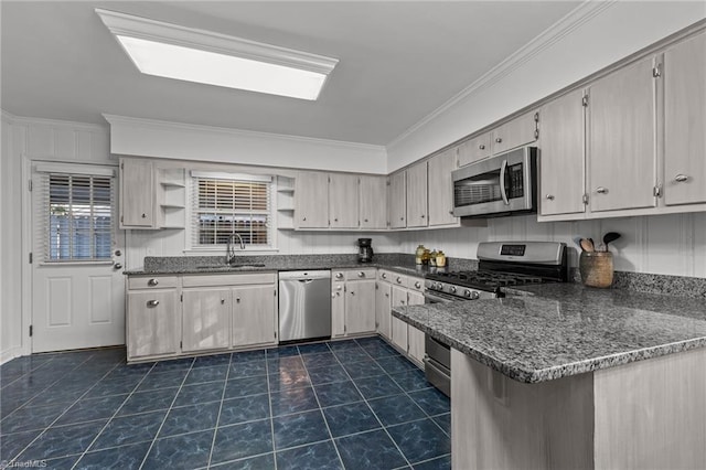 kitchen featuring sink, dark stone countertops, dark tile patterned flooring, ornamental molding, and stainless steel appliances