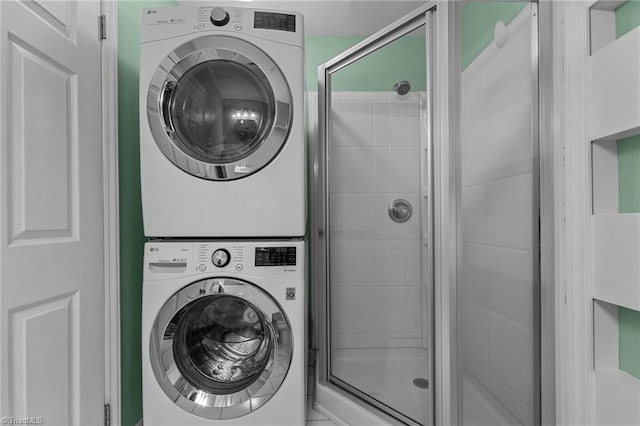 laundry area featuring stacked washer / dryer