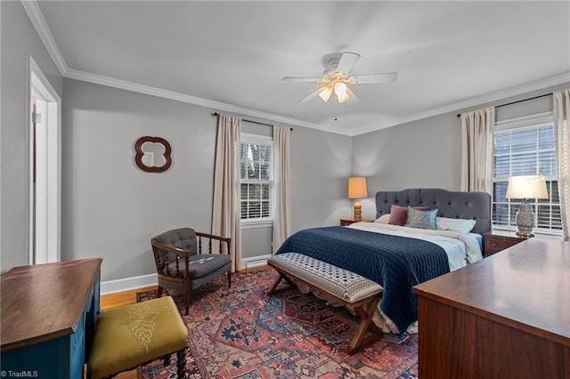 bedroom with ceiling fan, ornamental molding, and wood-type flooring