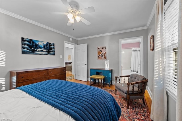 bedroom featuring hardwood / wood-style flooring, crown molding, and ceiling fan