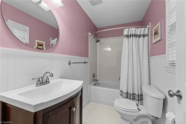 full bathroom with shower / bathtub combination with curtain, vanity, and toilet