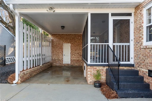 entrance to property featuring a carport