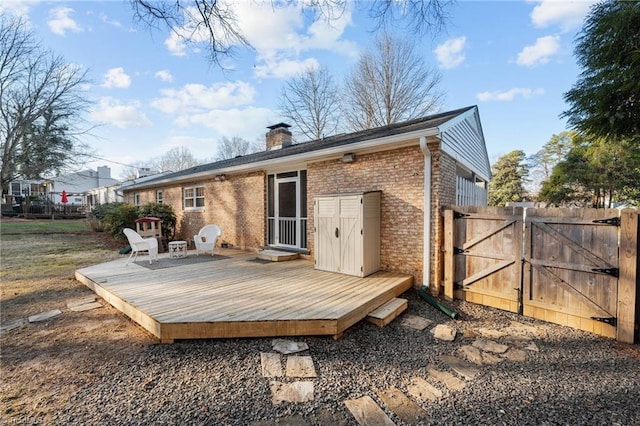 rear view of house with a wooden deck