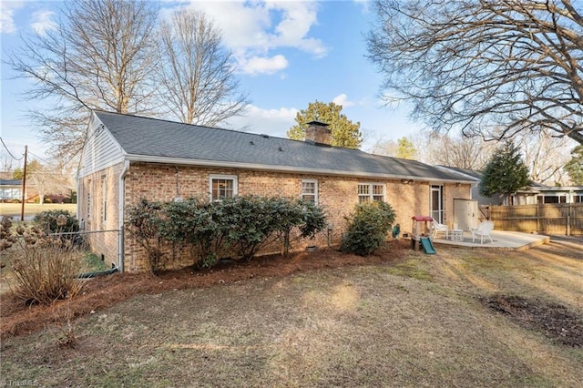 back of house with a patio