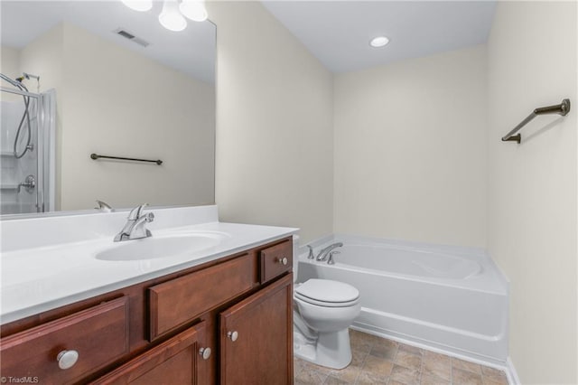 full bathroom featuring separate shower and tub, vanity, and toilet