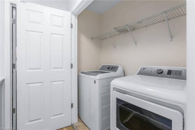 laundry room with washer and dryer