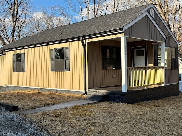 view of side of home with a porch