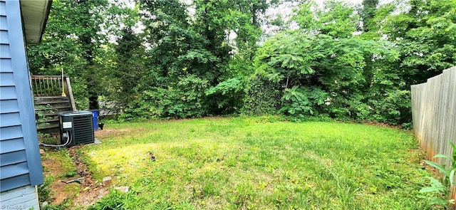 view of yard featuring central air condition unit