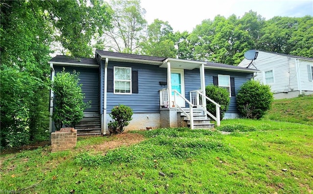 view of front of home with a front yard