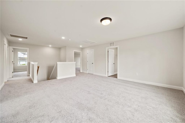 5757 Siler St, Trinity, NC 27370 - spare room featuring visible vents, attic access, carpet, and baseboards