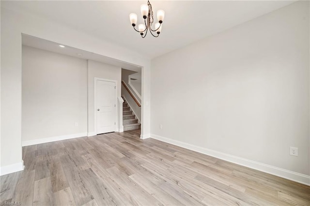5757 Siler St, Trinity, NC 27370 - unfurnished room featuring stairway, a chandelier, baseboards, and light wood finished floors