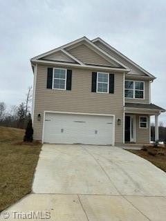 front of property with a garage