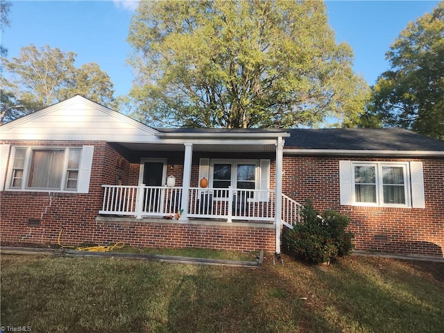 view of front of home with a front lawn and a porch