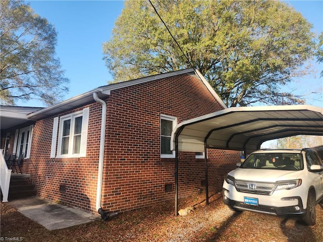 view of home's exterior with a carport