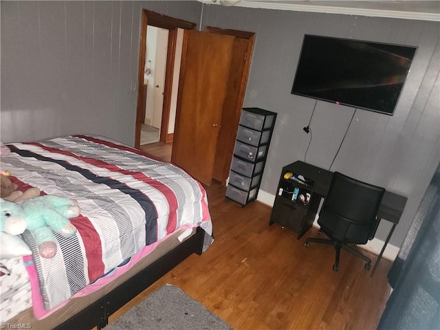 bedroom featuring wood-type flooring