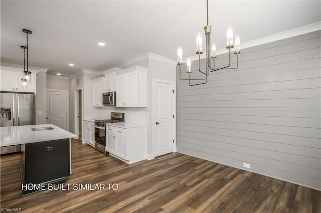 6963 Orchard Path Dr, Clemmons, NC 27012 - kitchen with stainless steel appliances, ornamental molding, recessed lighting, light countertops, and white cabinetry