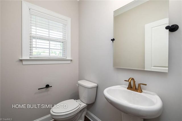 6963 Orchard Path Dr, Clemmons, NC 27012 - bathroom with a sink, toilet, and baseboards