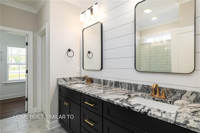 6963 Orchard Path Dr, Clemmons, NC 27012 - bathroom with marble look tile flooring, double vanity, baseboards, and ornamental molding