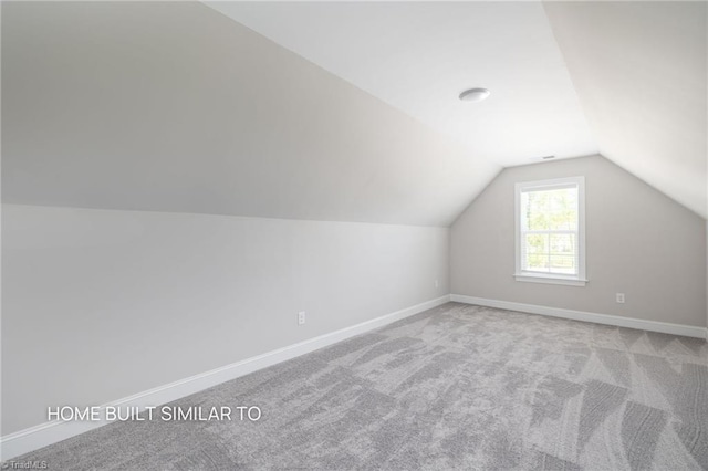 6963 Orchard Path Dr, Clemmons, NC 27012 - additional living space featuring vaulted ceiling, carpet, and baseboards