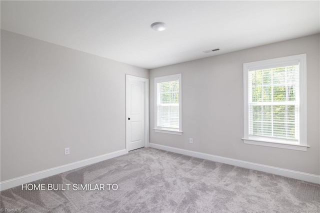 6963 Orchard Path Dr, Clemmons, NC 27012 - unfurnished room featuring baseboards, healthy amount of natural light, and carpet flooring