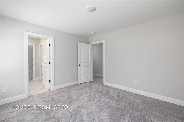6963 Orchard Path Dr, Clemmons, NC 27012 - unfurnished bedroom featuring carpet and baseboards