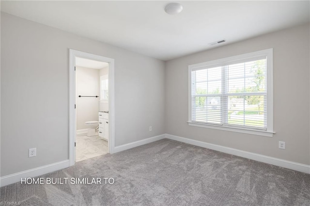 6963 Orchard Path Dr, Clemmons, NC 27012 - carpeted empty room featuring plenty of natural light and baseboards