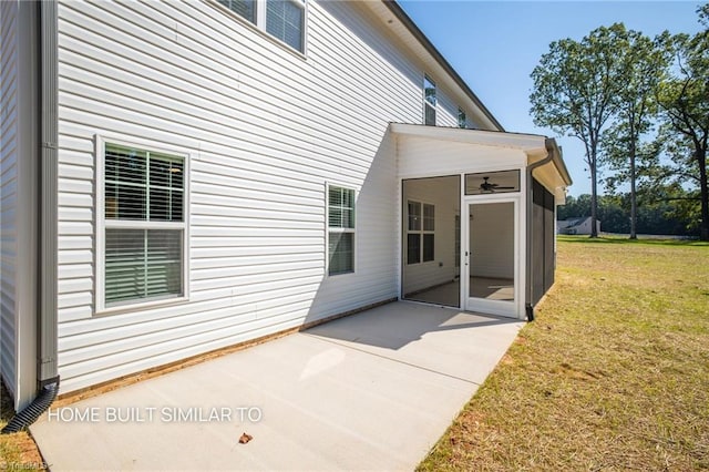 6963 Orchard Path Dr, Clemmons, NC 27012 - back of property featuring a sunroom, a patio area, and a lawn