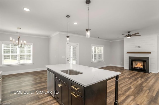6963 Orchard Path Dr, Clemmons, NC 27012 - kitchen featuring dishwasher, baseboards, hanging light fixtures, a ceiling fan, and a fireplace