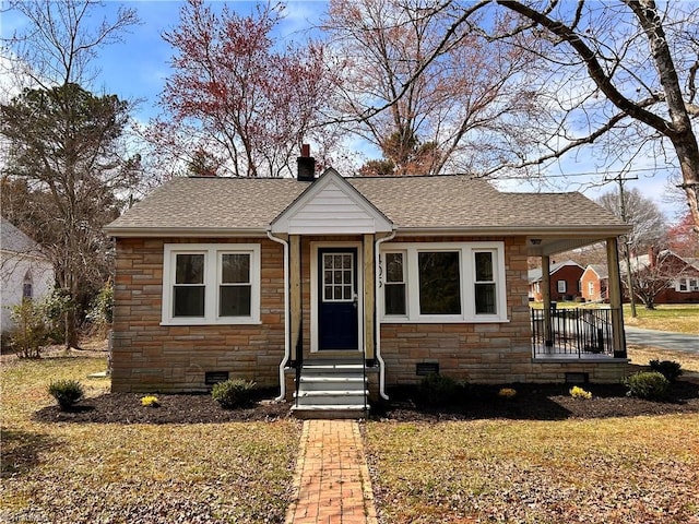 bungalow featuring entry steps, stone siding, a shingled roof, crawl space, and a chimney