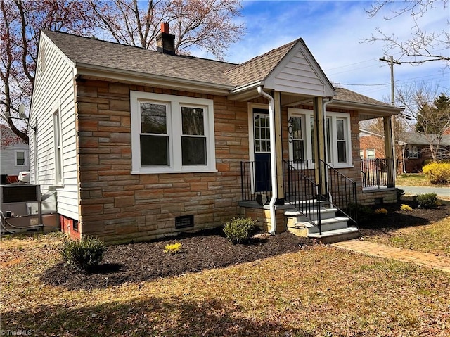 view of front of property with crawl space, stone siding, a chimney, and roof with shingles